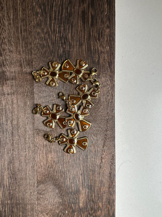 Charm cruz peq marrón